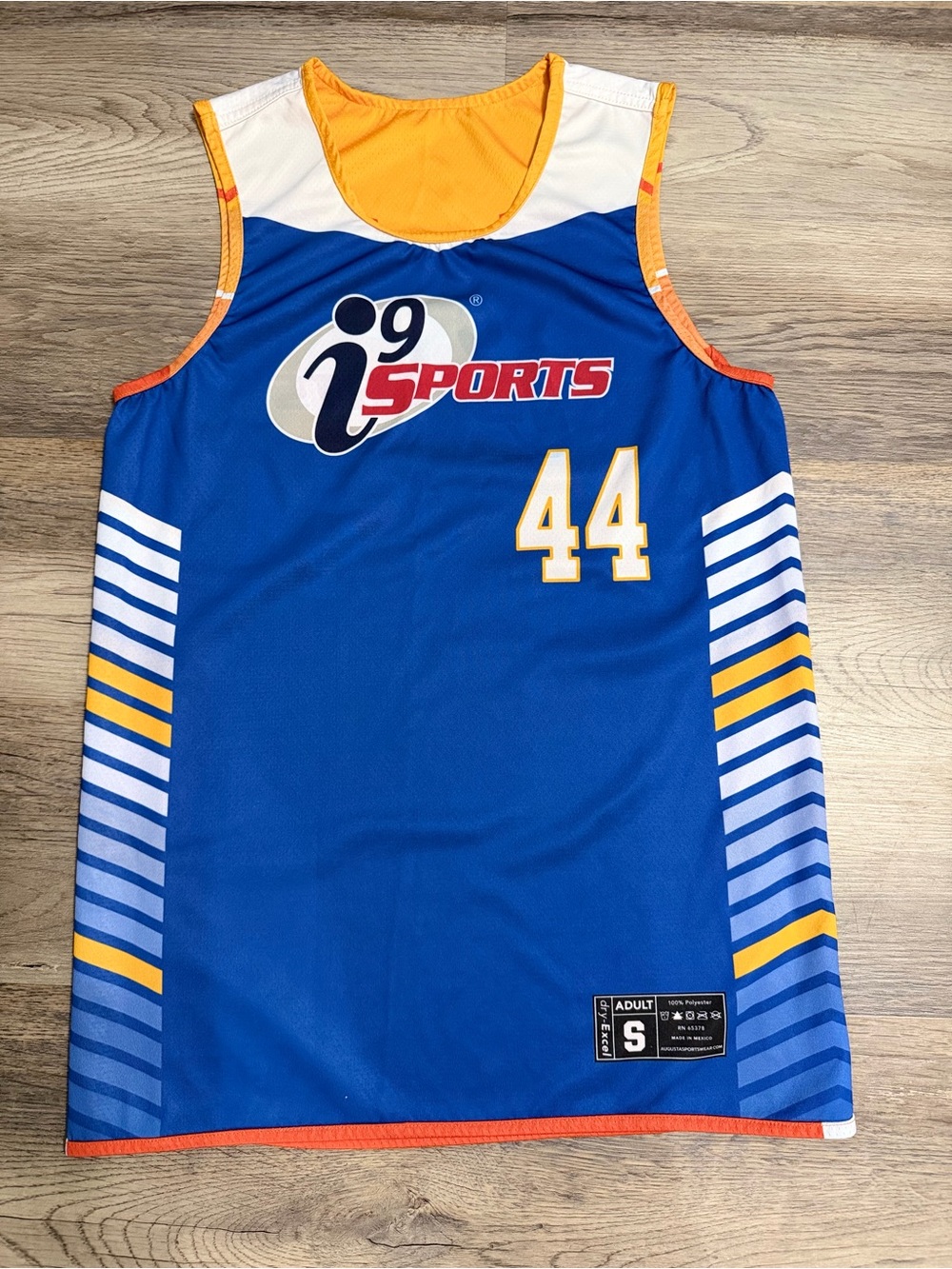 Augusta Sportswear Blue Jersey with Yellow and Orange Accents Reversible.